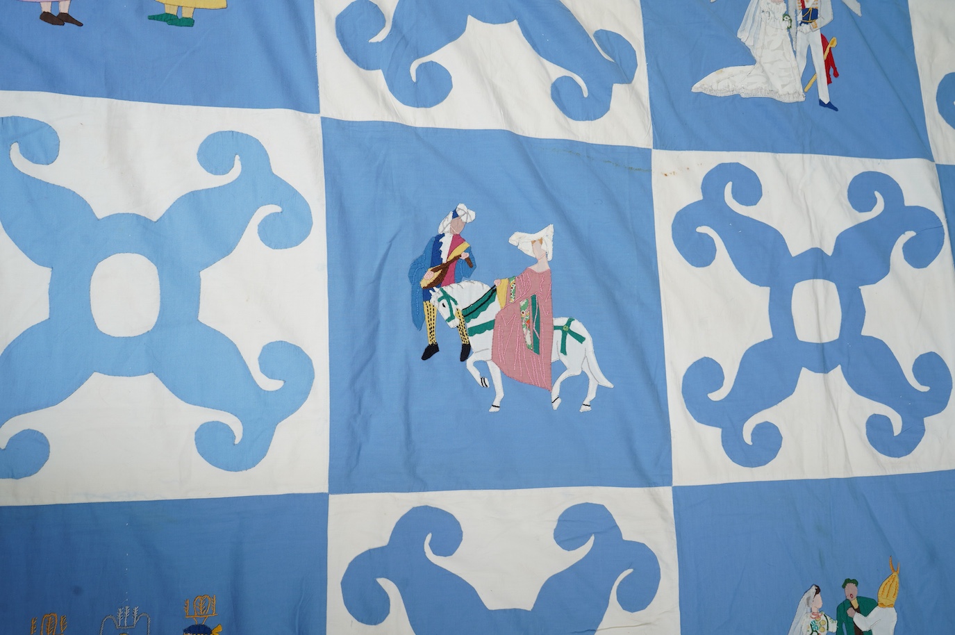 A rare figurative American ‘bridal quilt coverlet’, designed by Marion Cheever Whiteside Newton, whose designs were originally widely published in magazines and sold during the 1940’s-50’s. Her ‘quilting kits’ were also